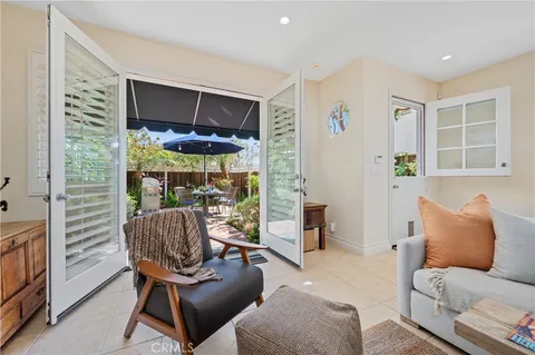 a view of an outdoor sitting area with furniture and barbeque grill