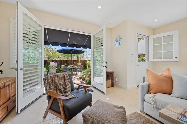 a view of an outdoor sitting area with furniture and barbeque grill