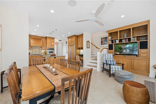 a view of kitchen with kitchen island and stainless steel appliances