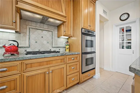 a kitchen that has a lot of cabinets in it