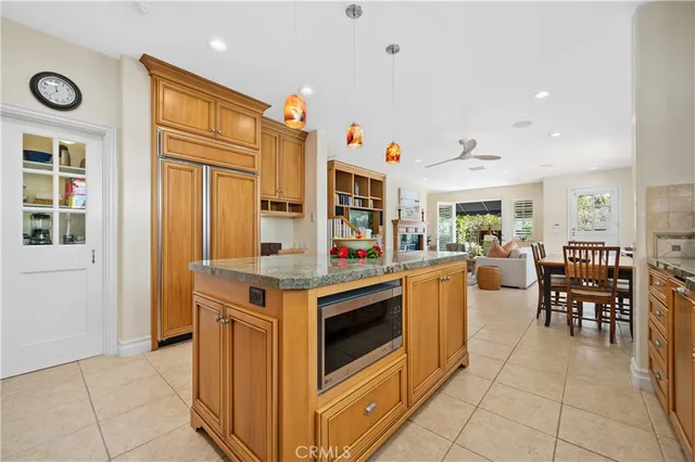 a kitchen with stainless steel appliances granite countertop a stove a sink and a granite counter tops