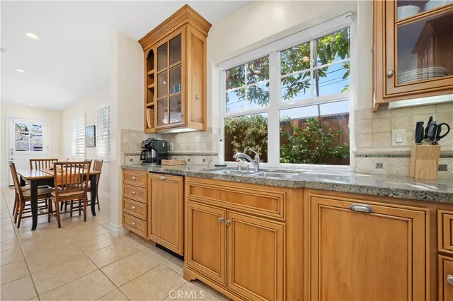 a room with furniture a rug and white walls
