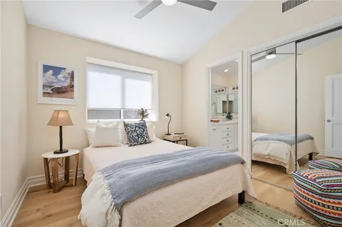a bathroom with double sink and a mirror