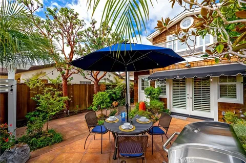 a view of a chairs and table in the patio