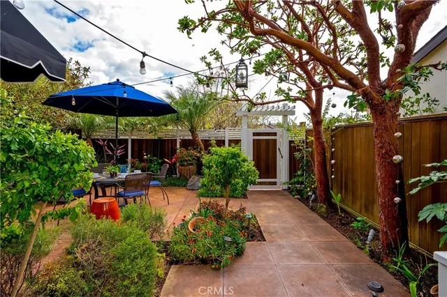 a view of a house with a yard and sitting area