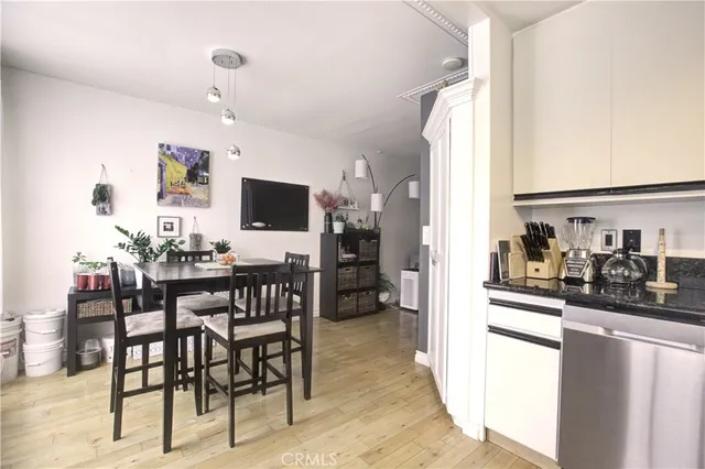 a kitchen with granite countertop stainless steel appliances and wooden cabinets
