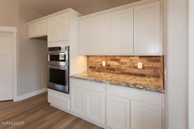 a view of kitchen with wooden floor