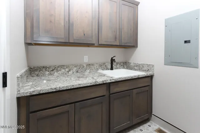 a kitchen with granite countertop cabinets and sink