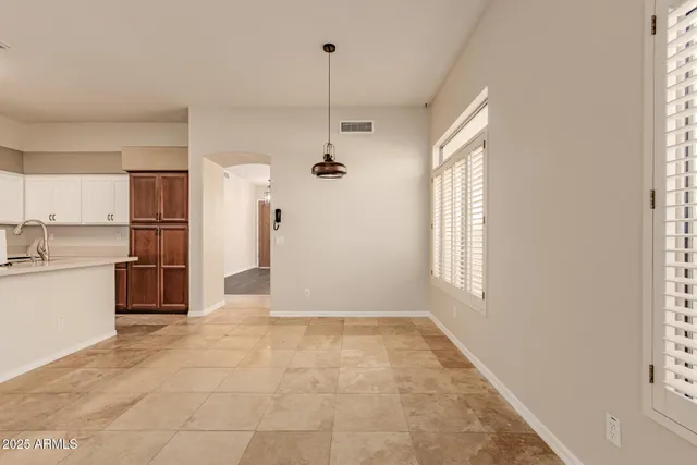 a view of a kitchen with a sink and a window
