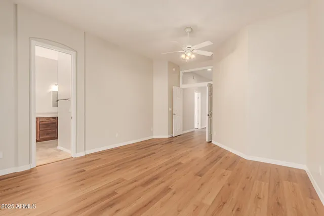 a view of an empty room and wooden floor