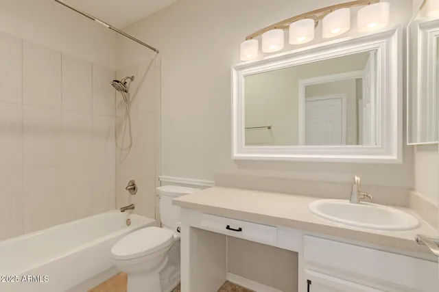 a bathroom with a sink toilet a mirror and shower