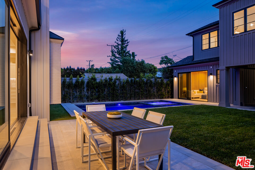 628 10th Street Santa Monica, CA 90402 - Photo 14 of 48 a view of swimming pool with seating space and yard in the back