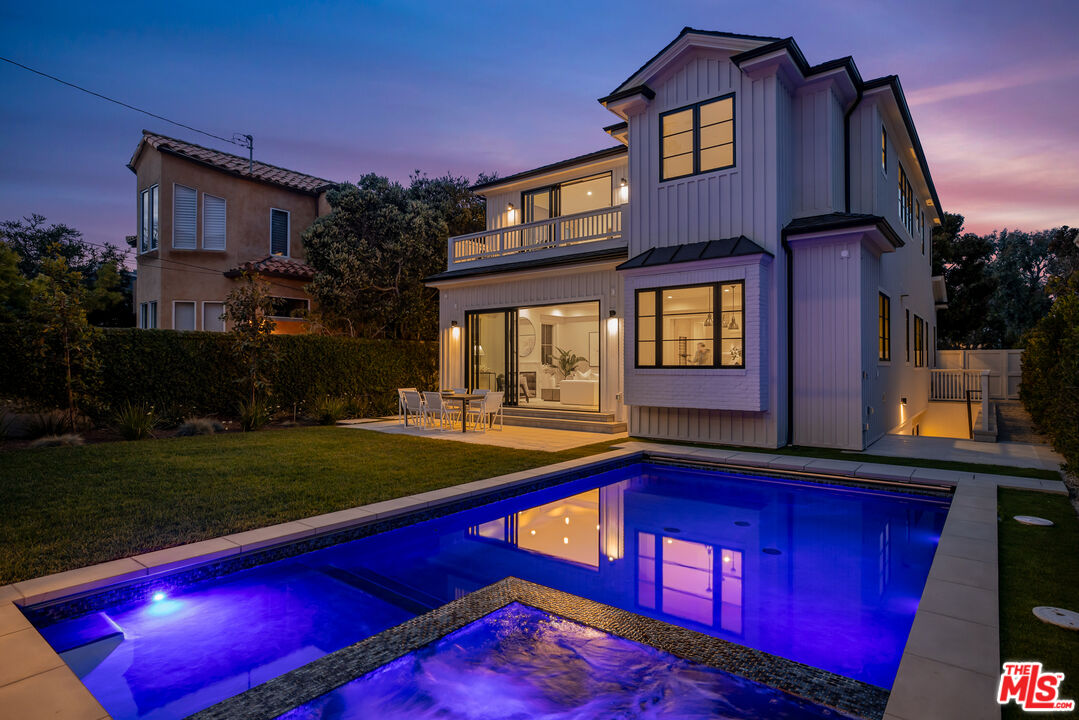 628 10th Street Santa Monica, CA 90402 - Photo 15 of 48 a view of a house with pool and a yard