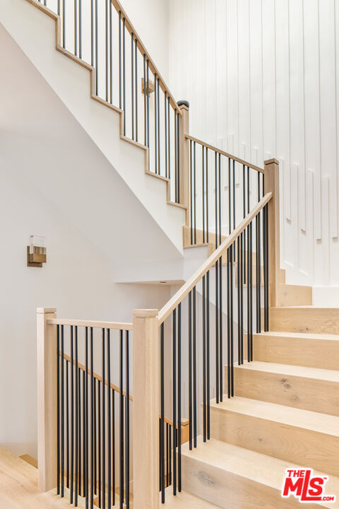 628 10th Street Santa Monica, CA 90402 - Photo 16 of 48 a view of staircase with lots of frames on wall and a window