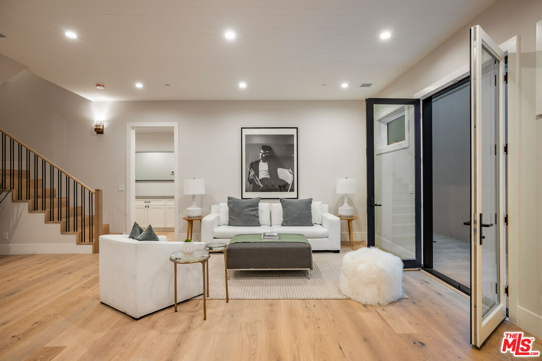 628 10th Street Santa Monica, CA 90402 - Photo 27 of 48 a living room with furniture and a wooden floor