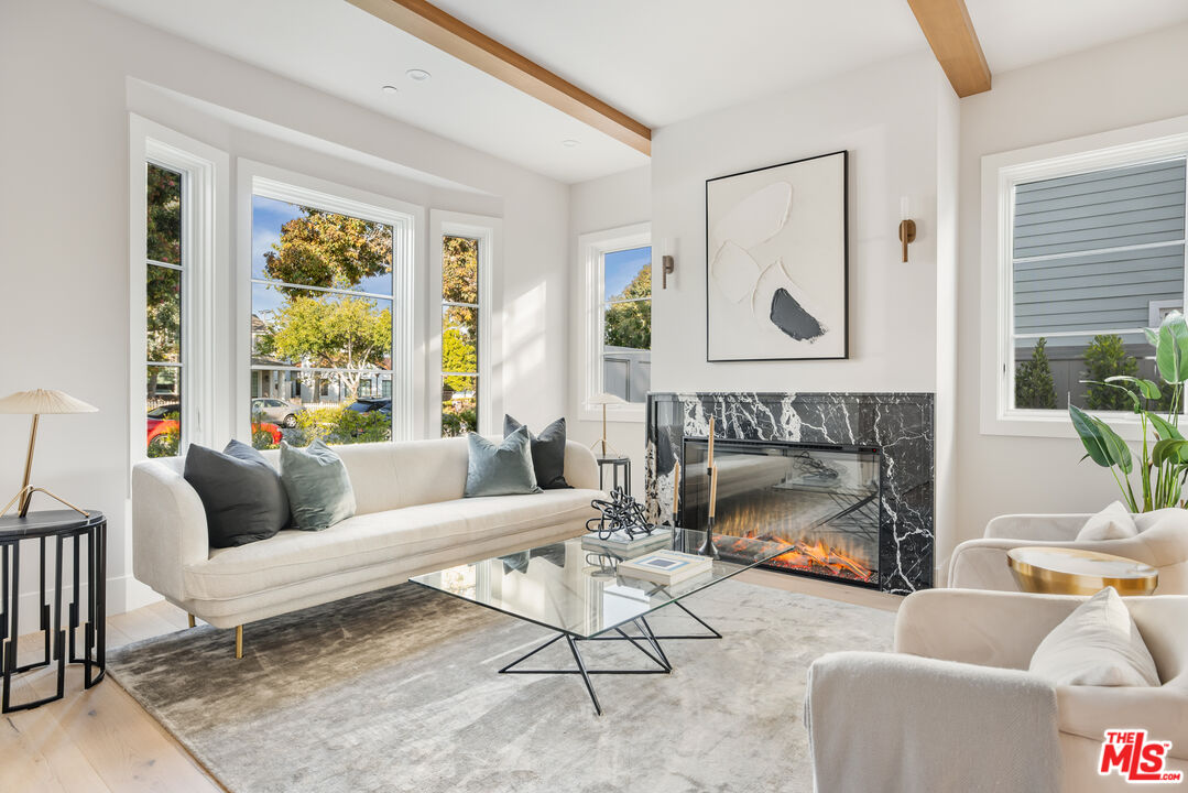 628 10th Street Santa Monica, CA 90402 - Photo 3 of 48 a living room with furniture and a fireplace