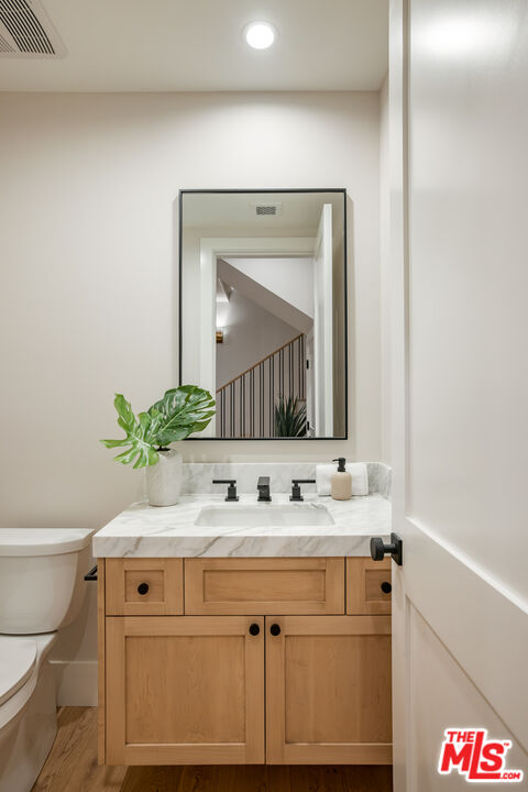 628 10th Street Santa Monica, CA 90402 - Photo 31 of 48 a bathroom with a sink and a mirror