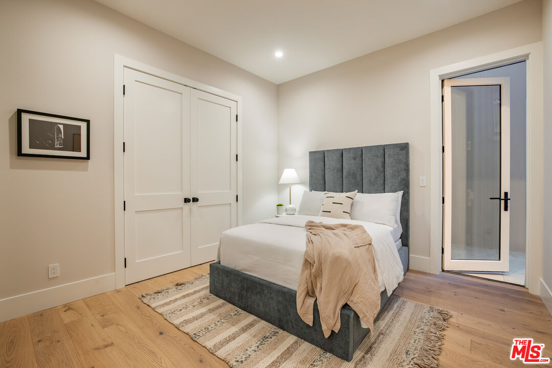 628 10th Street Santa Monica, CA 90402 - Photo 33 of 48 a bed room with a bed and a night stand