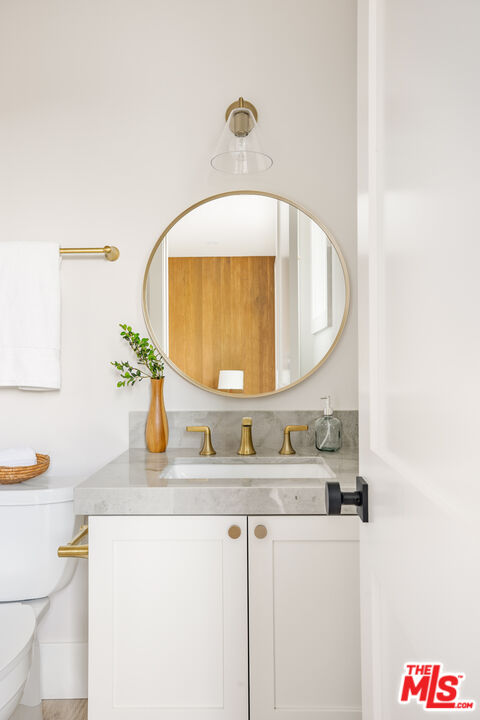 628 10th Street Santa Monica, CA 90402 - Photo 36 of 48 a bathroom with a sink and a mirror
