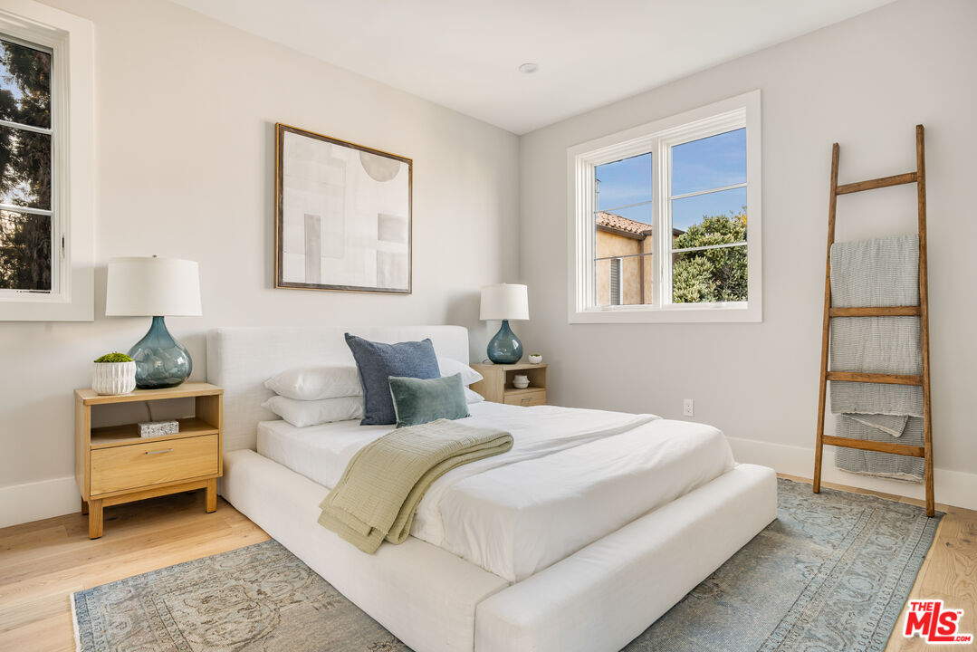 628 10th Street Santa Monica, CA 90402 - Photo 40 of 48 a bedroom with a bed and a window