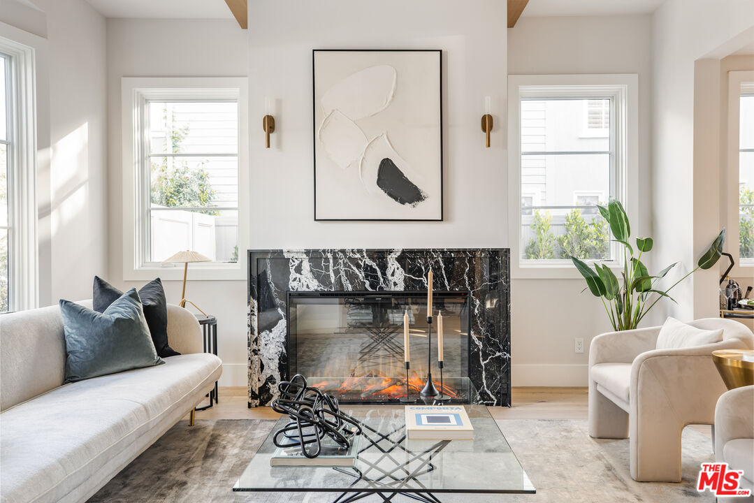 628 10th Street Santa Monica, CA 90402 - Photo 4 of 48 a living room with furniture a window and a fireplace