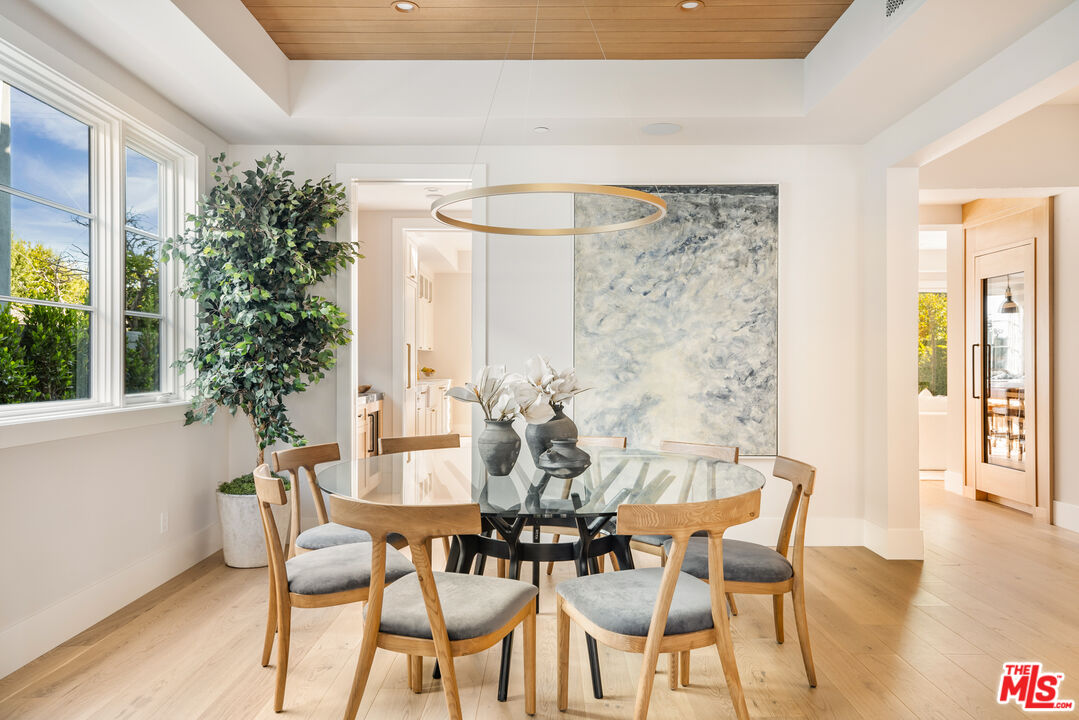 628 10th Street Santa Monica, CA 90402 - Photo 5 of 48 a dining room with furniture and wooden floor