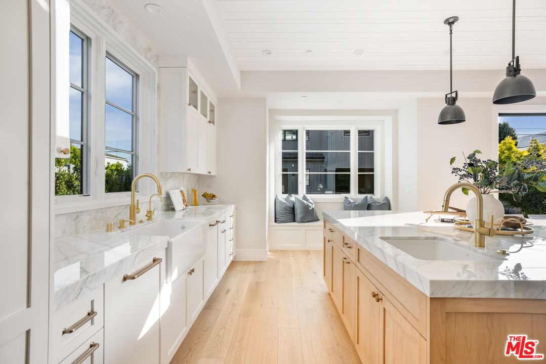 628 10th Street Santa Monica, CA 90402 - Photo 8 of 48 a large white kitchen with a window