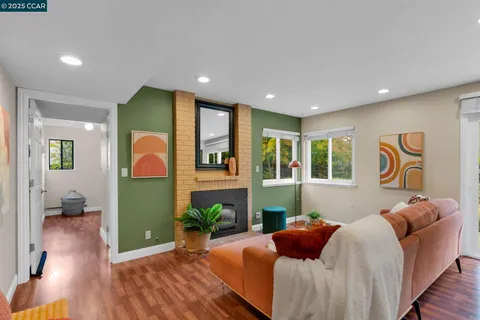 a spacious bedroom with a bed and wooden floor