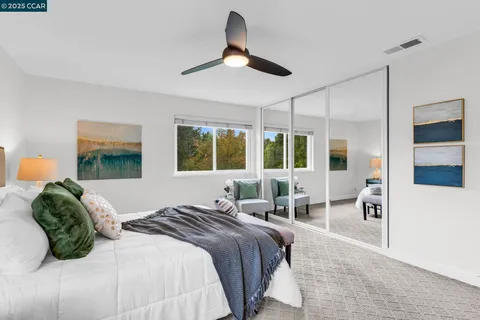 a bedroom with a large bed and a window