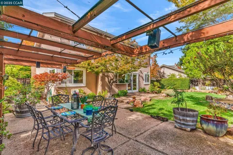 a view of an outdoor space with a table and chairs