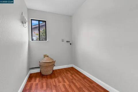 a bathroom with a toilet and a window