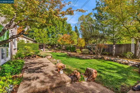 a backyard of a house with lots of green space