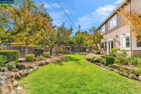 a backyard of a house with lots of green space