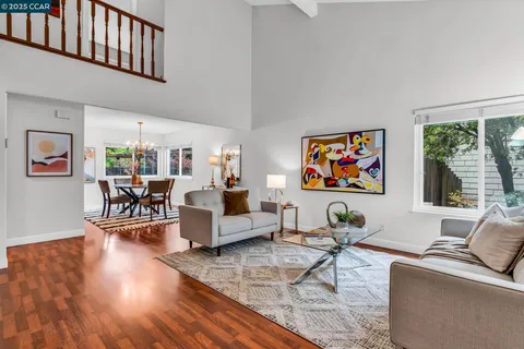 a living room with furniture or couch and a large window