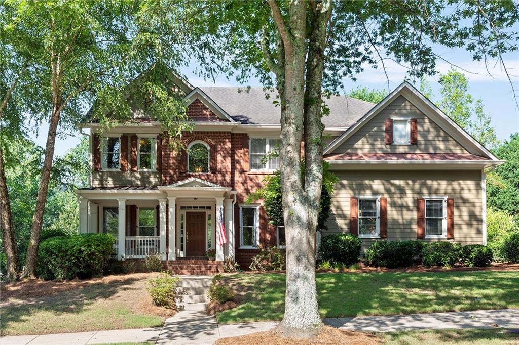 4810 Spring Park Circle Suwanee, GA 30024 - Photo 1 of 1 front view of house with a yard