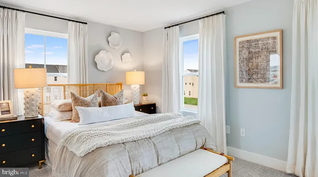 a bedroom with bed and a window