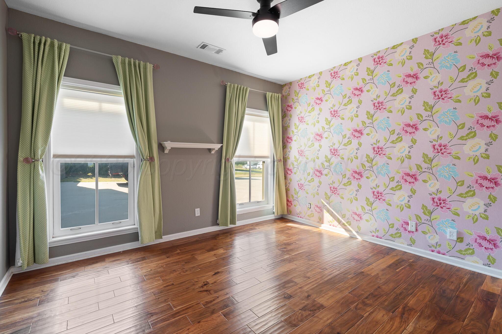 17301 Spring Lake Drive Canyon, TX 79015 - Photo 27 of 62 wooden floor in an empty room with a window