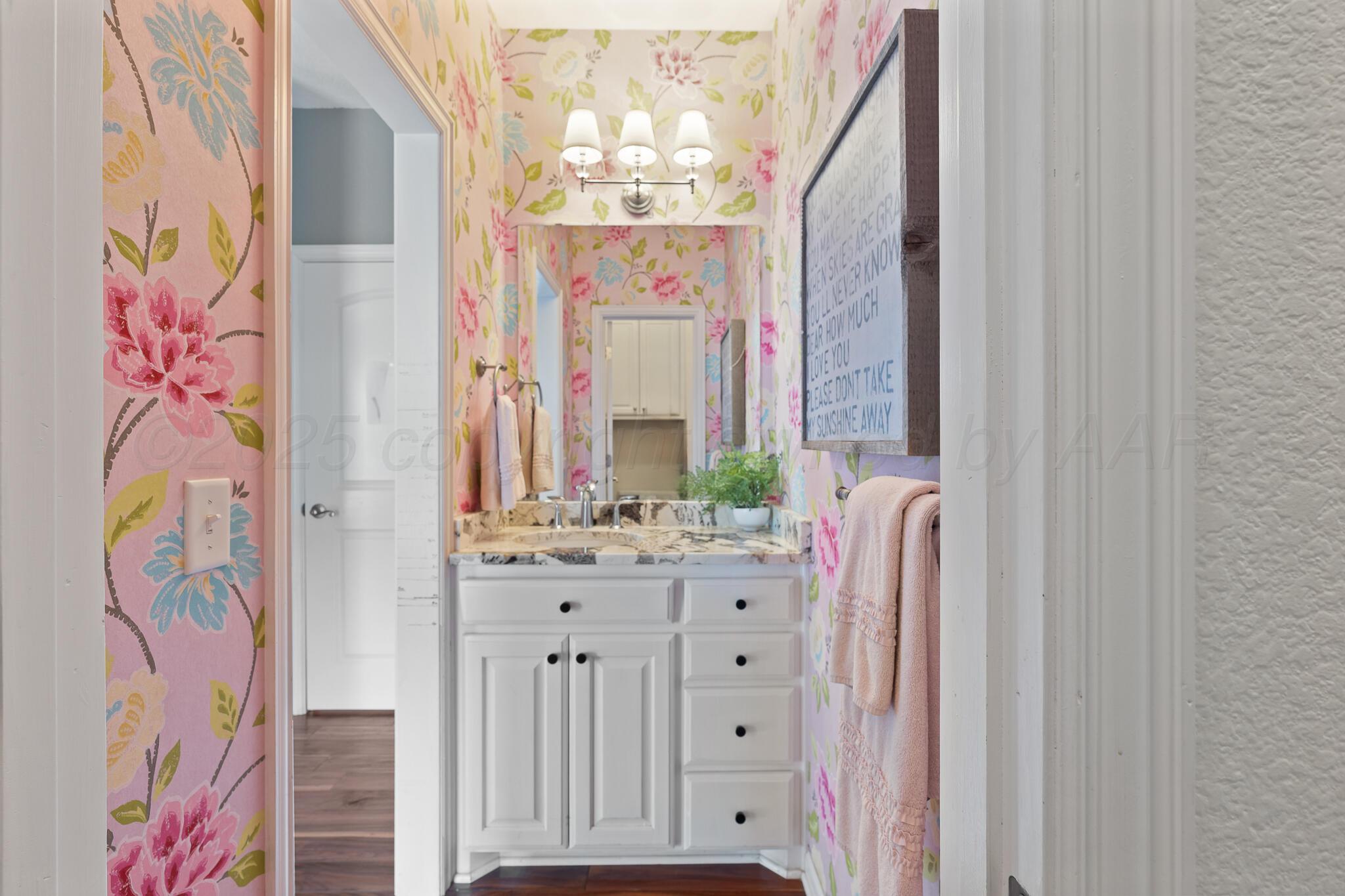 17301 Spring Lake Drive Canyon, TX 79015 - Photo 30 of 62 a bathroom with a sink a vanity and a mirror