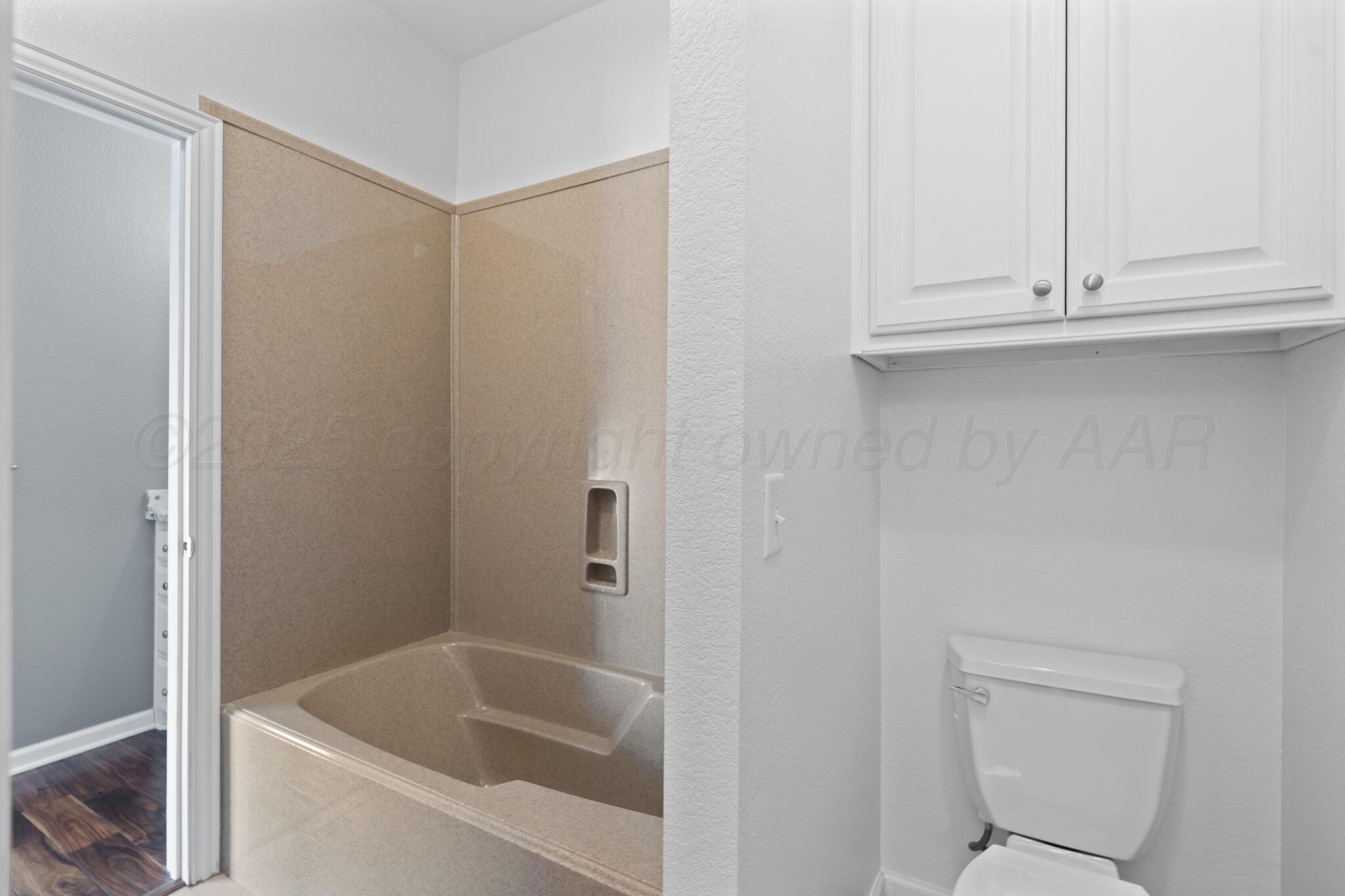 17301 Spring Lake Drive Canyon, TX 79015 - Photo 32 of 62 a bathroom with a bathtub