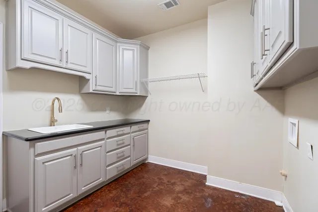 an aerial view of a house with a ocean view