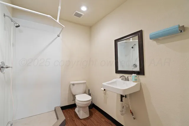 an aerial view of a house with a ocean view