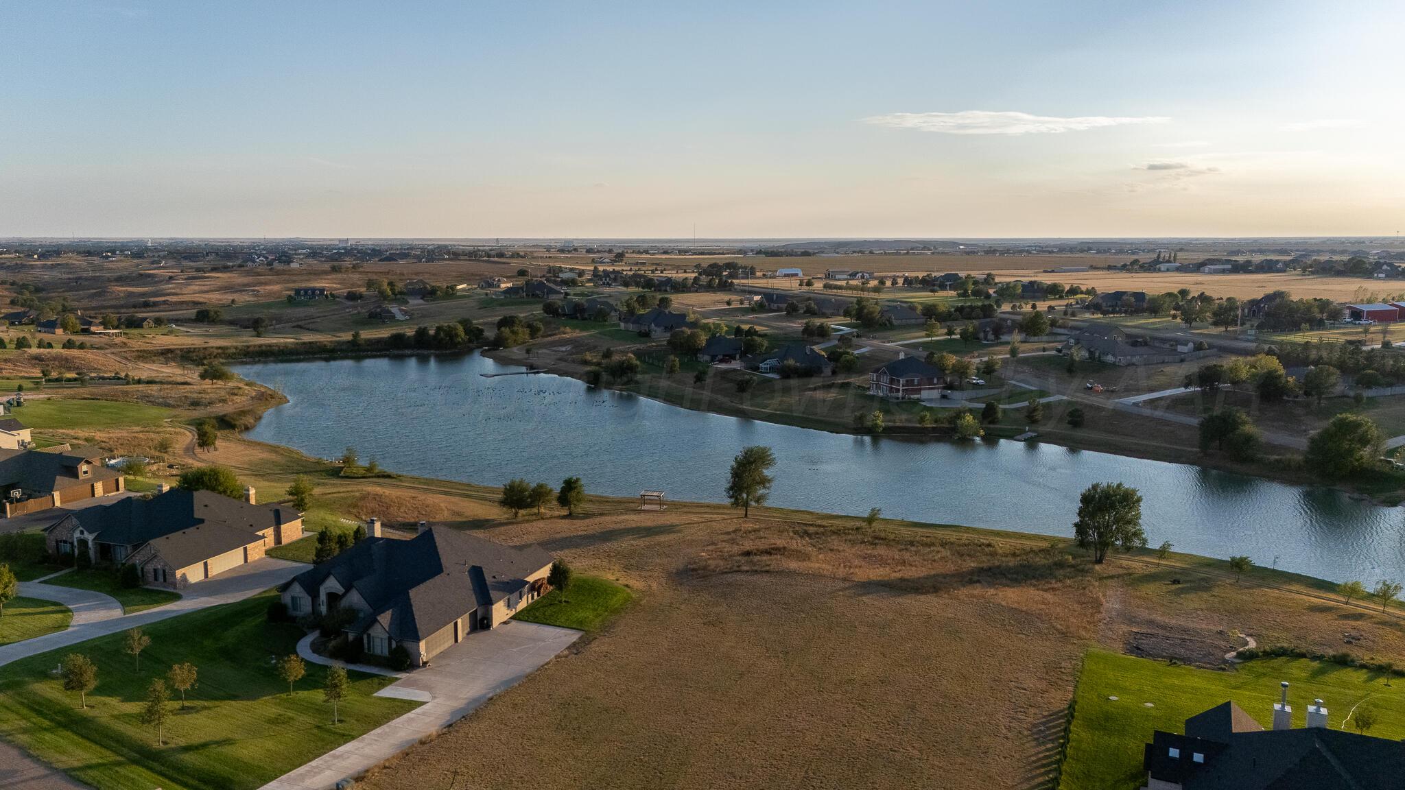 17301 Spring Lake Drive Canyon, TX 79015 - Photo 61 of 62 an aerial view of a house with a lake view