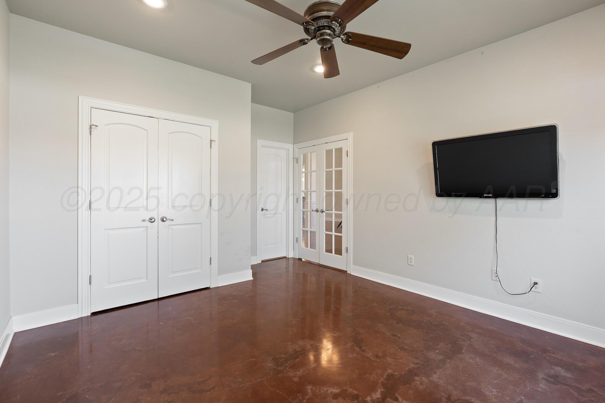 17301 Spring Lake Drive Canyon, TX 79015 - Photo 10 of 62 a view of a livingroom with a flat screen tv