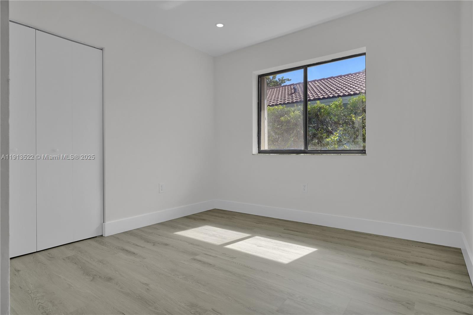 20127 Southwest 88th Court, Unit 20127 Cutler Bay, FL 33189 - Photo 8 of 19 an empty room with a window