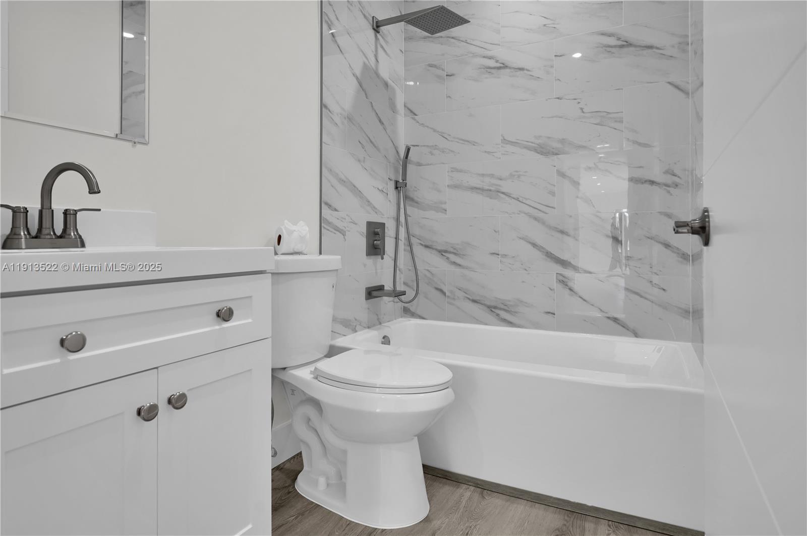 20127 Southwest 88th Court, Unit 20127 Cutler Bay, FL 33189 - Photo 9 of 19 a bathroom with a sink a toilet and shower