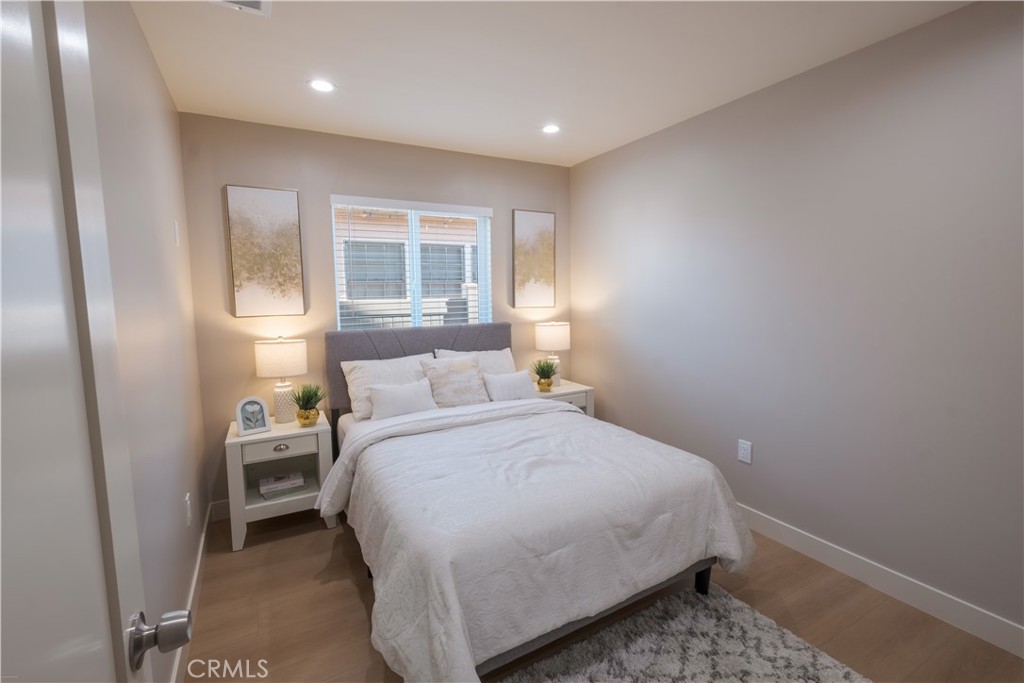 223 South Aprilia Avenue Compton, CA 90220 - Photo 15 of 46 a bedroom with a bed and a window
