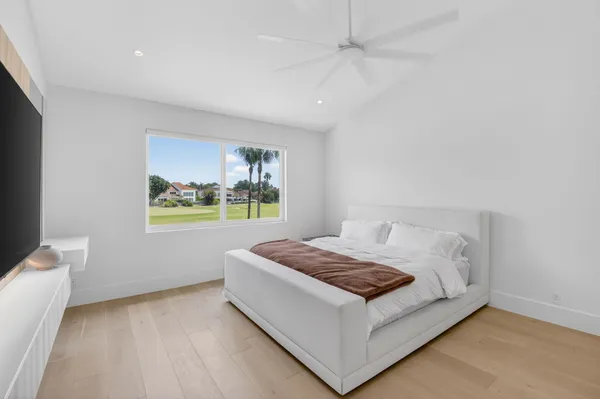 a room with a bed and window