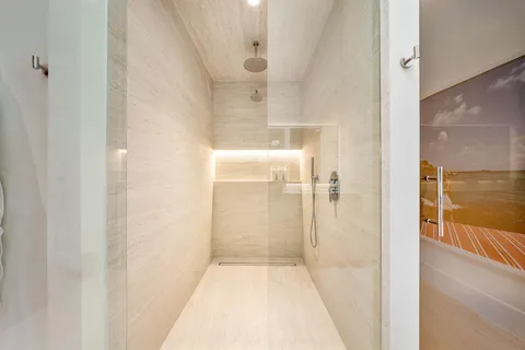 a bathroom with a bathtub shower sink and a toilet