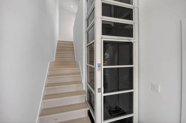 a view of an empty walk in closet with empty racks