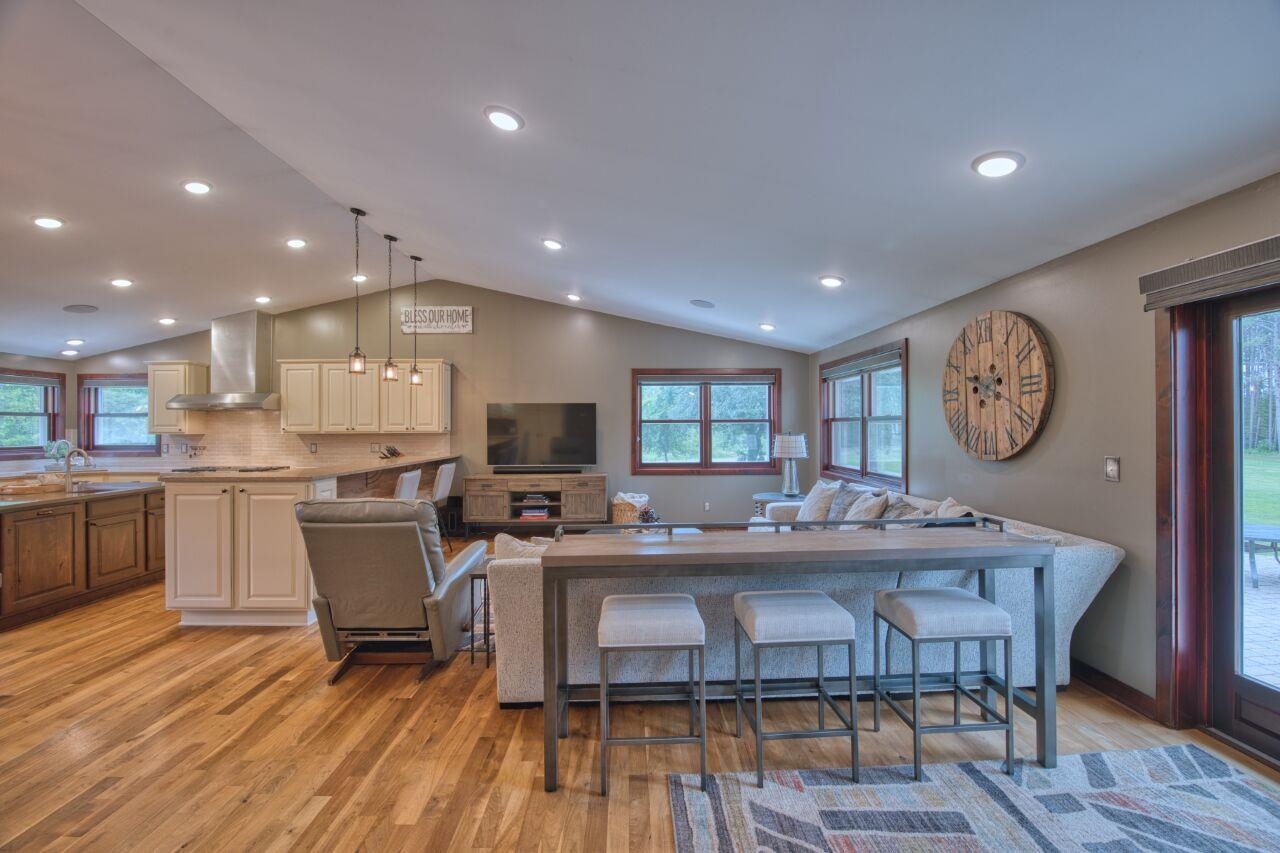3557 Haverkamp Road Hibbing, MN 55746 - Photo 14 of 60 Living room featuring lofted ceiling, light wood-style floors, and recessed lighting